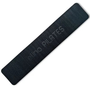 "Elina Pilates Mini Anti-Slip Pad – slim, black pad designed to enhance grip and stability during Pilates exercises on various equipment."

